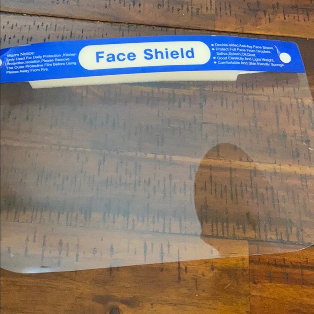 Face shield- New (still with protective shield)